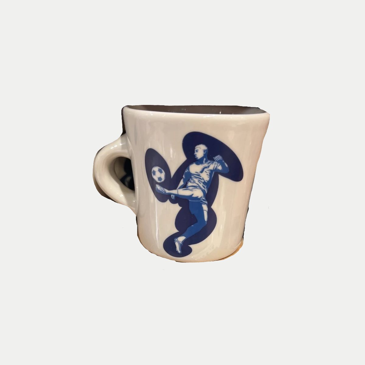 The same mug cut out cleanly onto a neutral tile