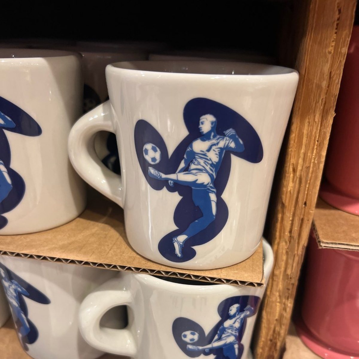 The original photo of a mug on a crowded store shelf